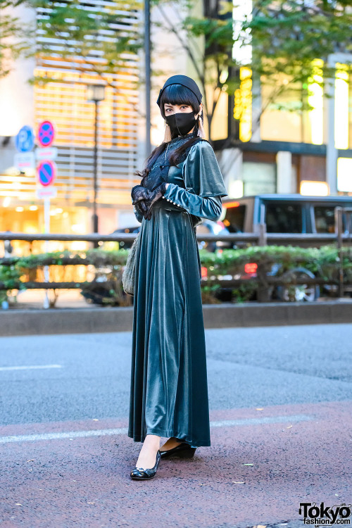 18-year-old Japanese student Mikael on the street in Harajuku wearing a green velvet dress by Pameo 