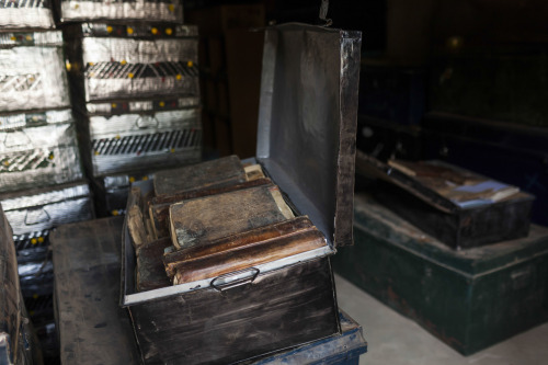 Boxes containing thousands of ancient manuscripts are seen in a safe house after their evacuation fr