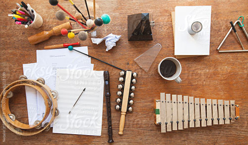 Overhead view of a music teacher&rsquo;s desk with random instruments By nataliejeffcottAvailabl