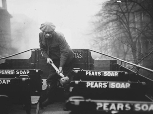 A public health worker carries a spray pump for uses on buses (England [?], March 1920).  In the sec