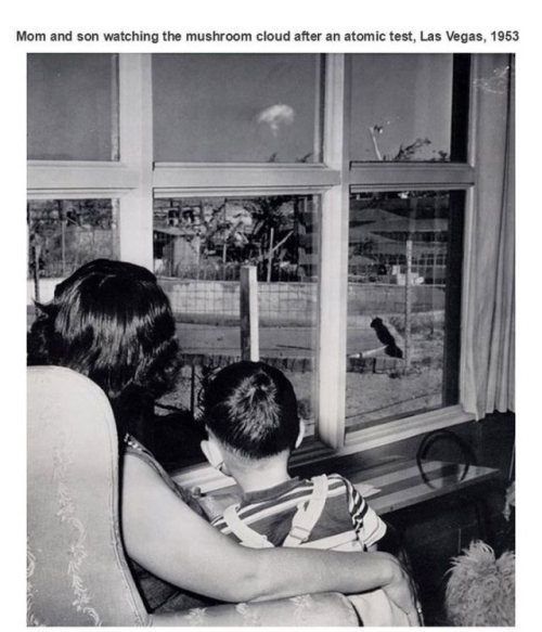 theniftyfifties:  Mother and son watching the mushroom cloud after an atomic test,