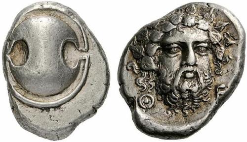 lionofchaeronea:Silver stater of Thebes, featuring a Boeotian shield on the obverse and the head of 