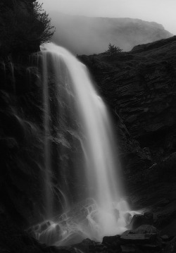 earth-song:  This is a slightly long exposure taken during a foggy evening, portraying one of my favorite waterfalls in the Gran Paradiso National Park.Somewhat hidden, its flow of water is always a magical experience for the eyes. by Roberto Bertero