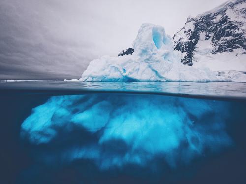 amazinglybeautifulphotography:An iceberg from above and below. From the Antarctica Peninsula. [OC][2
