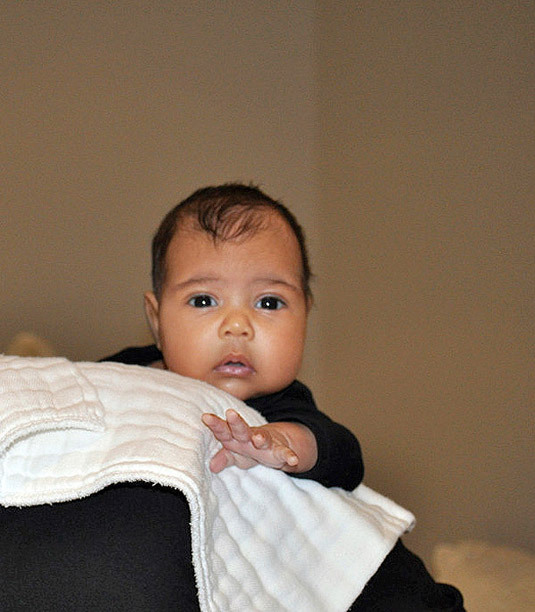 Kanye West debuts a first look at his two-month-old daughter North during his interview on Kris Jenner’s talk show season finale.