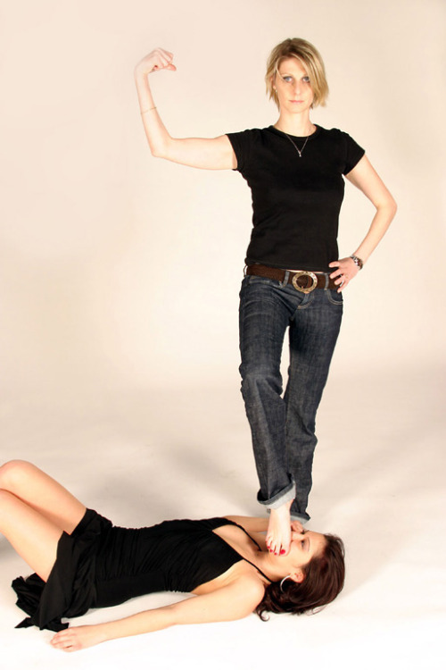 Sex Blond in jeans posing in victory over brunette pictures