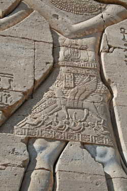 dwellerinthelibrary: Hieroglyphs at Dendera Temple 15 by ruthhallam on Flickr. Pharaoh wears a kilt on which, in the form of a griffin, he tramples his enemies. 