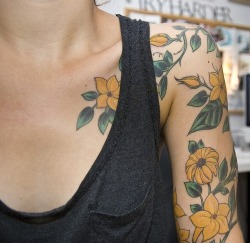 celestial-railroad:  yellow flower tattoo