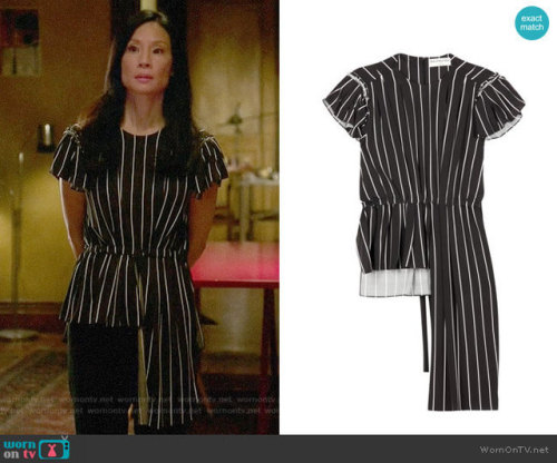 wornontv‌:Joan’s striped asymmetric top on Elementary: Frill Striped Top by Balenciaga at Mytheresa,