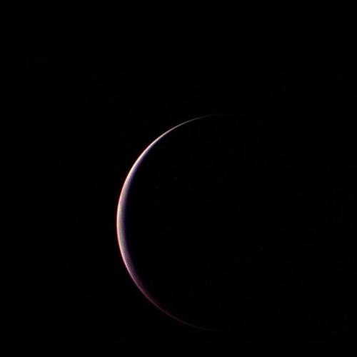 NASA Voyager 2 obtained this parting shot of Triton, Neptune largest satellite, shortly after closes