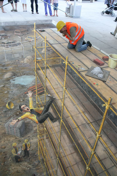 unknowngenre:  3D Pavement Drawings by Julian Beever  Anamorphic illusions are drawn in a special distortion in order to create an impression of 3 dimensions when seen from one particular viewpoint.  more 