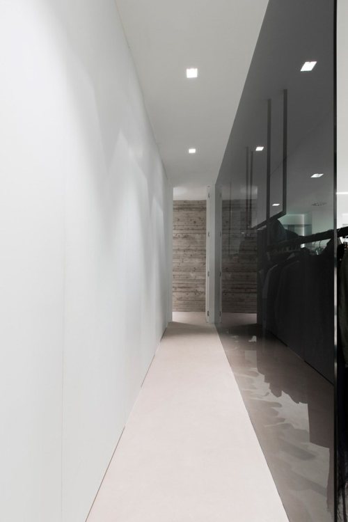 {Love the contrast of the clean simple walls, with the beautifully lit painted brick and stone.} via