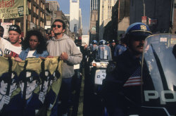 kradhe:  USA. New York City. 1992. Protesting the Rodney King verdict in Times Square.  Gilles Peress  
