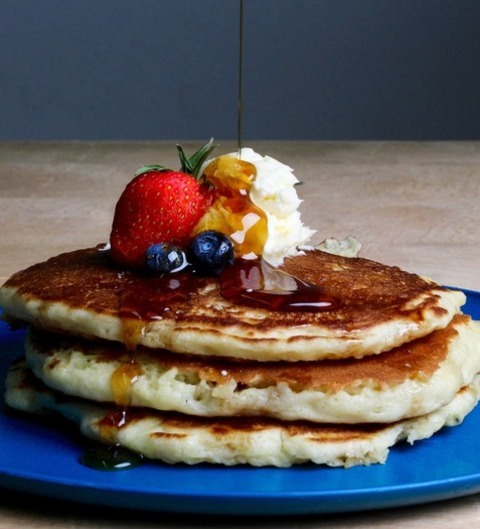 Pancakes With Strawberries, Blueberries, And Maple Syrup