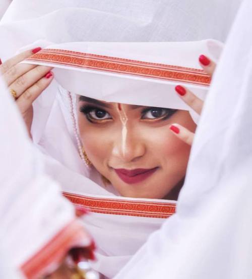 Hidden faces, Beautiful veiled woman protecting themselves from the colored powders, Holi Festival a