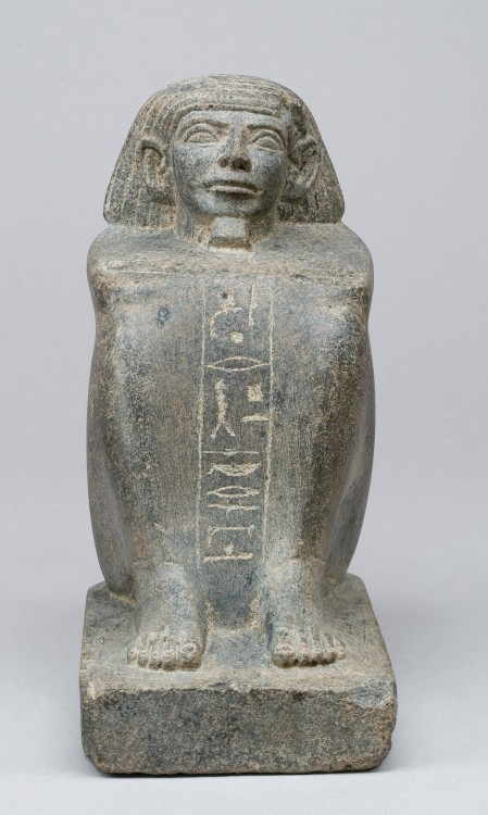 Block statue (diorite) of one Minhotep.  Artist unknown; ca. 1850-1640 BCE (late 12th or early 