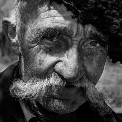 Portraits of ethnic Tajik, Kazakh, Russian, Uyghur, and Kyrgyz men in various hats in Xinjiang.Photo