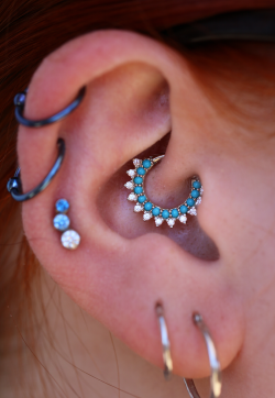 tobiasxvallone:  One of my favorite daith piercings to date. Featuring a beautiful Gem Kolo ring from BVLA with turquoise set in 14k white gold. 😍  Healed piercing by Tobias.