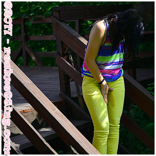 realwetting:  After a walk in the garden, Monica is deliberately wetting her yellow