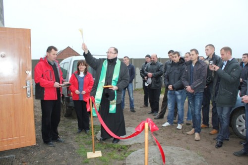 Polish priest blessing a new pigpen. Smolice, 2012.