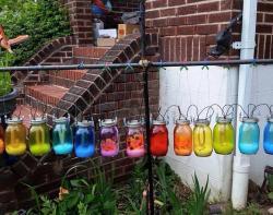 scottlynch78:  matociquala:  A Maryland woman, a widowed mother of four, received the note above concerning her display of rainbow solar jars in her own yard. (Story at the Portland Edge, here.)That’s the relentless gayness that might harm the children.