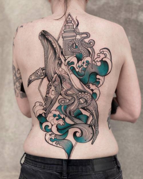 allthepiercingsandbodymods:Whale back tattoo