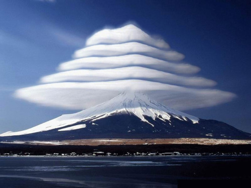 moorbay:Lenticular clouds over Mount Fuji, Japan. These are stationary lens-shaped clouds that form 