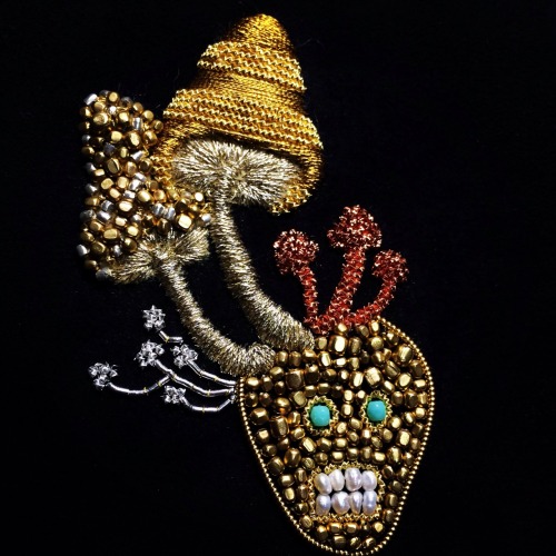 the man is growing mushrooms on his head. 2014 embroidery on fabric  ©Azumi Sakata
