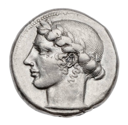 didoofcarthage:Silver tetradrachm of Leontinoi with laureate head of Apollo (obverse) and lion’s hea