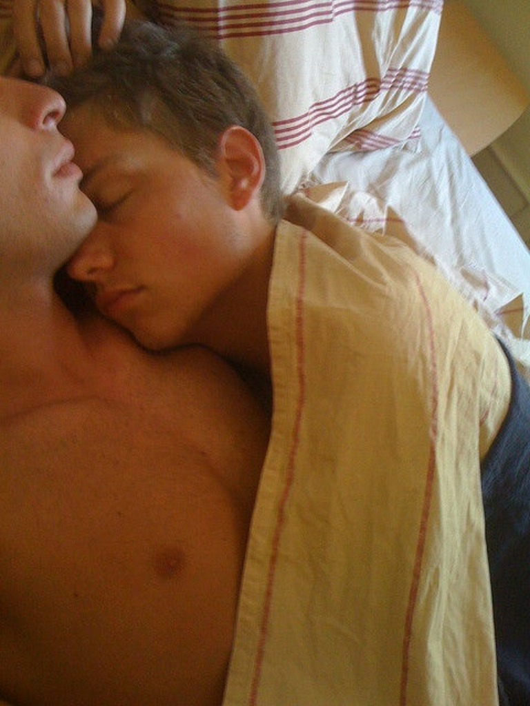 Cute gay guys cuddling