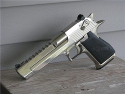 gunrunnerhell:  Desert Eagle XIX If a golden Desert Eagle is too gaudy or cliche; they do look pretty good in a polished nickel finish. Initially I thought the 50 AE models had a the new “tear drop” safety but its present on the .44 and .357 versions