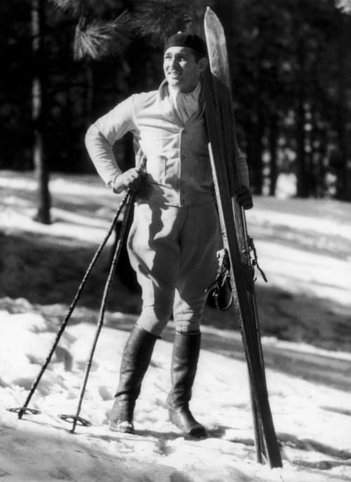 bygonehollywood:American actor Clark Gable takes in the scene at Lake Arrowhead in California on M