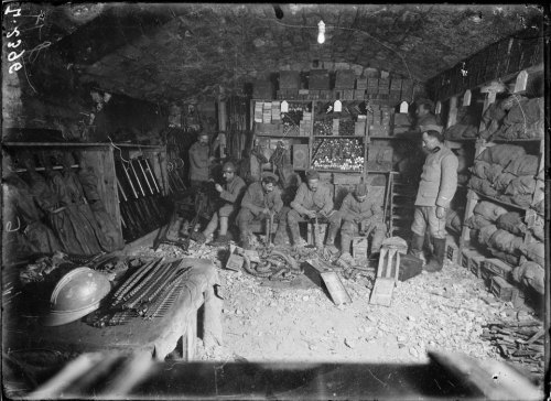 scrapironflotilla: A French quartermasters store at Verdun, 1917. On the table can be seen Hotchkiss