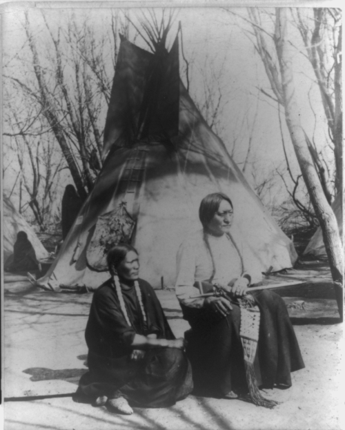 thebigkelu: Sitting Bull and his favorite wife. Sitting before tepee. American Indian prisoners of w