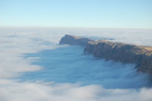 sixpenceee:The Grand Canyon Fills with Clouds in a “Once in a Lifetime” EventThe Canyon came to be filled with fog due to what’s known as a “temperature inversion,” a phenomenon whereby warm and cool air (which typically reside at lower and
