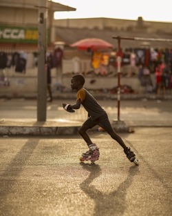 forafricans:  A young boy skates on the streets of Accra, Ghana. ©Emmanuel Bobbie