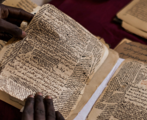 Malian copyist Boubacar Sadeck consults an ancient manuscript on July 29, 2013 in Bamako, Mali.&gt; 