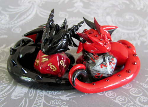 tomarou:  rosesakurax:  thatfilthyanimal:  ensorevolution:  Tiny Dragons That Take Care of Your Gaming Dice http://www.themarysue.com/dice-dragons-becca-golins/#0  [SCREAMS] I WANT THEM  Cuteee  I couldn’t resist reblogging; NO REGRETS 