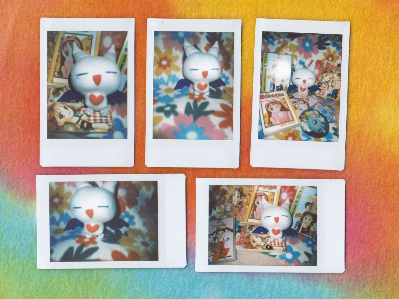 A bunch of polaroid photos of the plush!