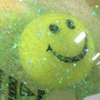 judestims:smiley face glittery ball!!!