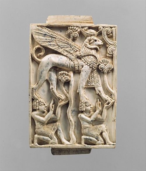 Plaque with two kneeling youths supporting a ram-headed sphinxPeriod: Neo-AssyrianDate: ca. 9th–8th 