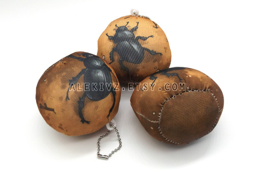 some dung beetle dung balls made with a squishy stretchy fabric and lightweight bead interior. perfe