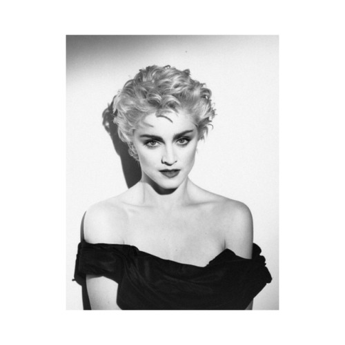 Madonna on the cover of a magazine in 1986 photographed by Herb Ritts.