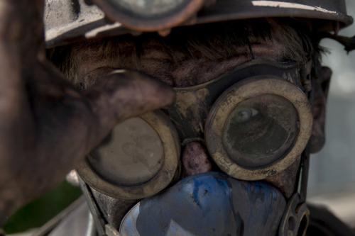  Photo:  Vadim Ghirda—AP Pictures of the Week: May 16 - May 23 A Ukrainian coal miner wears his goggles after finishing his shift at a coal mine outside Donetsk, Ukraine.  