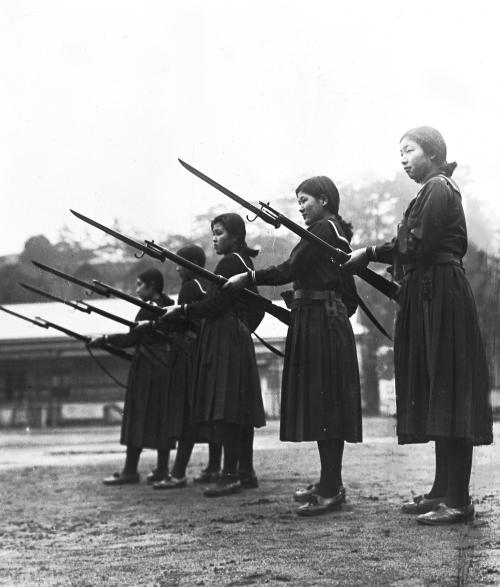 hjmarseille: Young Japanese schoolgirls learn how to charge an enemy with rifles and bayonets at the