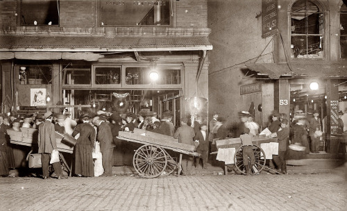 retropopcult:  Street vendors and shoppers at Boston’s night market. Photographed 1909 by Lewis Wickes Hine.