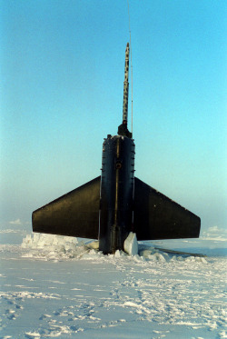 todaysdocument:  “The U.S. Navy’s attack submarine USS POGY (SSN 647) surfaces through 18 inches of Arctic ice. Standing lookout and perched high on the sail of the boat is Radioman Second Class Mark Sisson. While personnel are out on the ice, a lookout