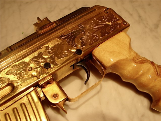 gunrunnerhell:  Bling?I think this started off as a Romanian Micro Draco Pistol but