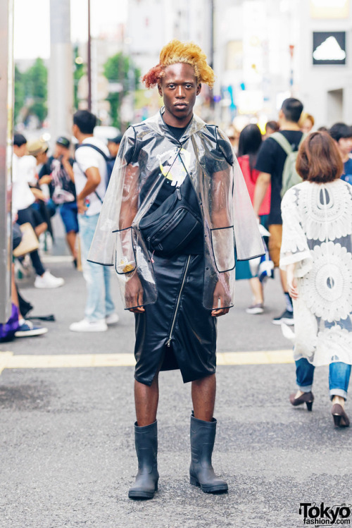 Paris-based fashion model Zelig on the street in Harajuku wearing a see through jacket from Zara wit