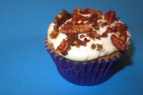 butter pecan cupcake with brown sugar pecans and a chocolate covered strawberry cupcake 